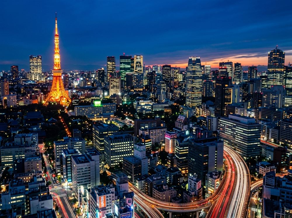 Tokyo city skyline with glowing Tokyo Tower at night